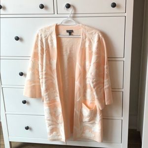 Long peach and white sweater coat
